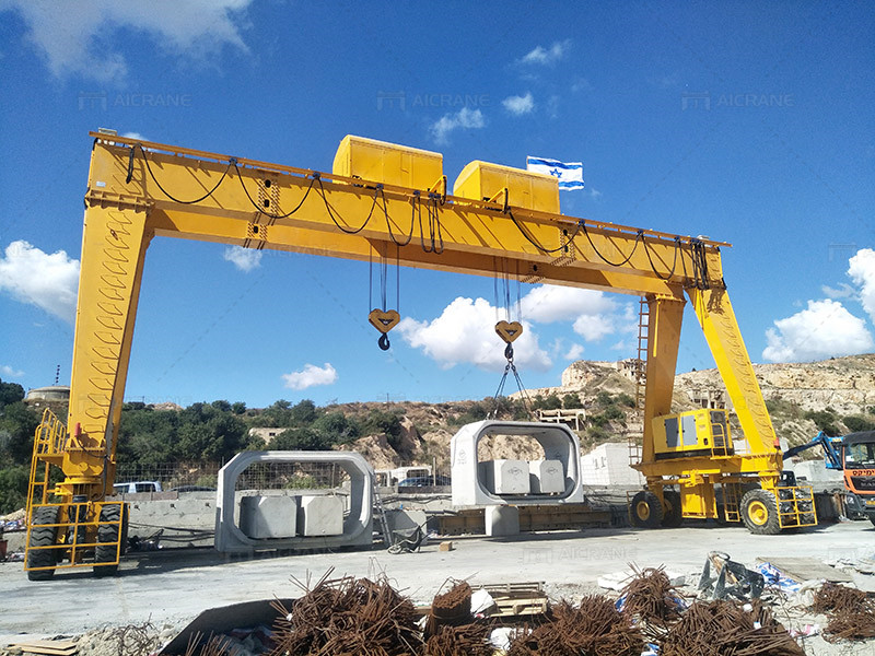 rubber tyred gantry crane lifting concrete block